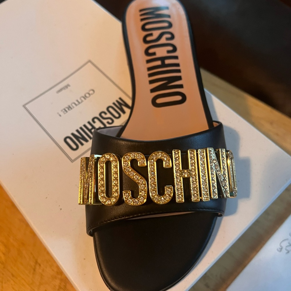 Moschino Black Mules with Gold Lettering